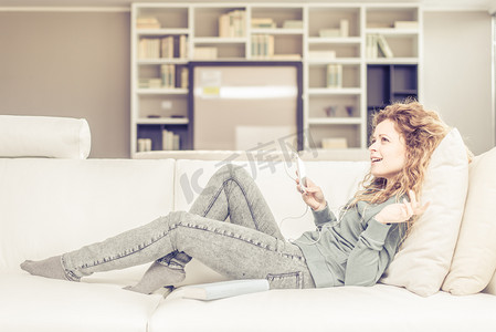 Woman listens music at home