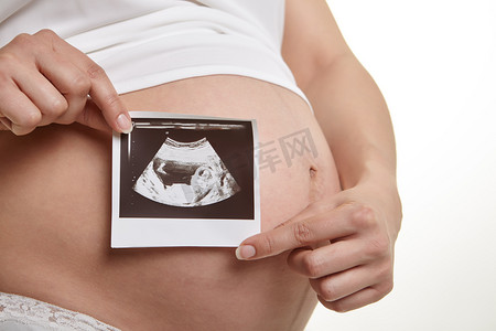 美容机摄影照片_可爱的孕妇腹部
