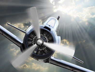 战争的摄影照片_在天空上戏剧性的一幕。老式战机飞机从太阳入站.