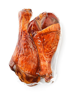 土耳其烤肉摄影照片_火鸡在真空包装中熏腿