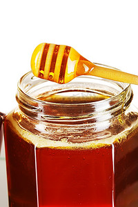 一罐蜂蜜和勺子