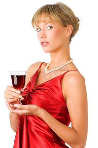精美的肖像o高档女士在红色礼服和一杯红酒