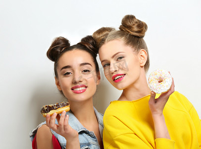 women with tasty donuts