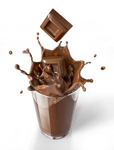入杯摄影照片_溅入一杯巧克力奶昔杯巧克力多维数据集.