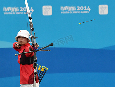 Li Jiaman of China competes in the final of the women's recurve individual of archery during the 2014 Summer Youth Olympic Games in Nanjing city, east Chinas Jiangsu province, 25 August 2014. 