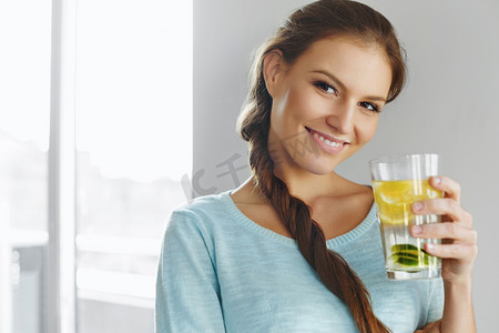 Healthy Lifestyle And Food. Woman Drinking Fruit Water. Detox. H