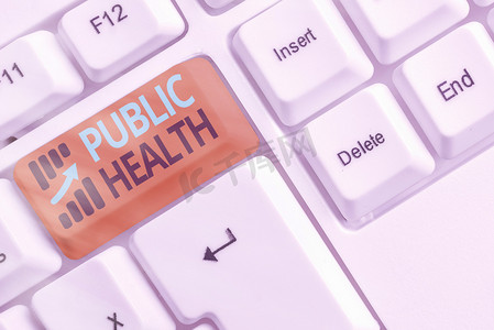 公共生活摄影照片_手写文本《公共卫生》。在白键复制空间之上空白键键盘保护和改善社区健康的科学概念.