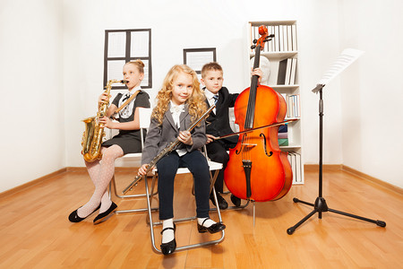 Happy kids playing musical instruments