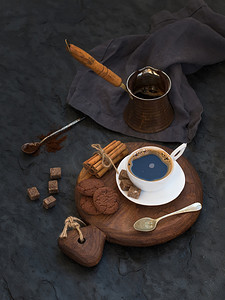 Cup of black coffee with chocolate biscuits
