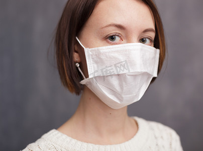 Girl in medical disposable mask