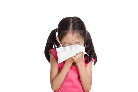 with摄影照片_Little asian girl sneeze with napkin paper