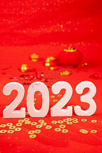 2023年年会摄影照片_新年白天2023室内金币摄影图配图