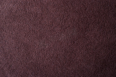 作为纹理背景的特写镜头深棕色绒面革软的皮革材质贴图地毯