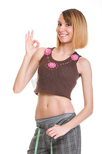 减肥背景摄影照片_漂亮女人穿着白色隔断的测量胶带展示她的减肥