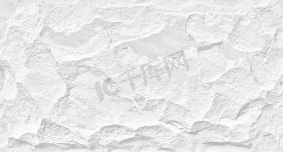 白色的石头垃圾背景，轻岩石墙壁与粗糙的纹理