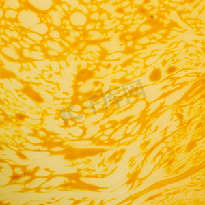 抽象的奶油黄色薄饼表面花纹纸花纹底