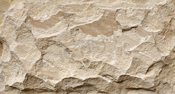米色天然石材垃圾背景，质地粗糙的岩壁