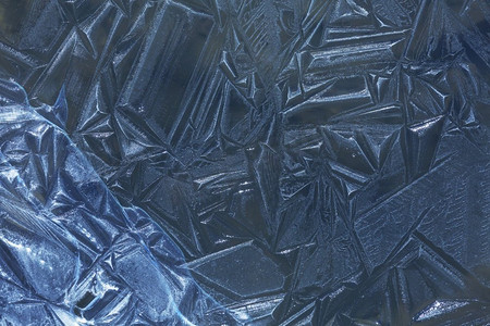 晶体纹理摄影照片_冬季背景的冰纹理