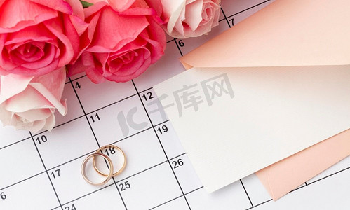 结婚戒指图标摄影照片_结婚戒指与鲜花日历