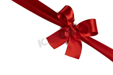 红色礼物蝴蝶结隔绝在白色背景上的节日礼物概念。白色上的红色礼物蝴蝶结