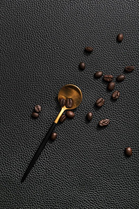金黑色图标摄影照片_咖啡豆金勺