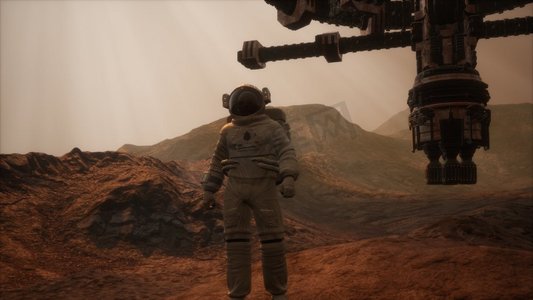 线性任务摄影照片_太空人走在红色星球火星上。太空任务宇航员在太空旅行。太空人走在红色星球火星上。太空任务