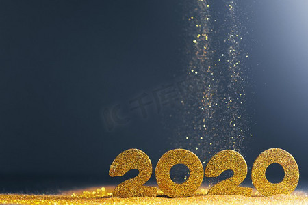 2020圣诞新年摄影照片_2020新年奢华设计理念。金色2020新年水平模板与金色闪光在蓝色背景。2020新年豪华设计