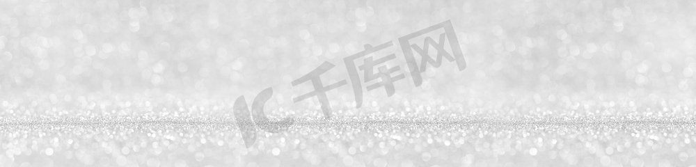 闪亮的银色波克闪光灯，抽象的背景，圣诞新年晚会的庆祝概念。闪亮的银色灯光背景
