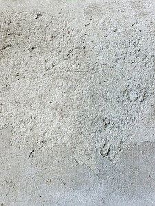 风化摄影照片_混凝土墙壁表面，灰色水泥纹理抽象背景.风化的垃圾桶结构。