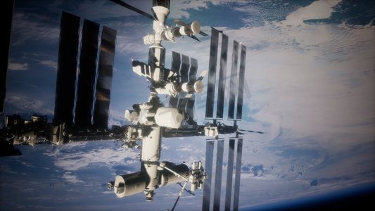 宇宙星球飞船摄影照片_地球与外层空间站。这张照片的元素由NASA提供。地球和外层空间站