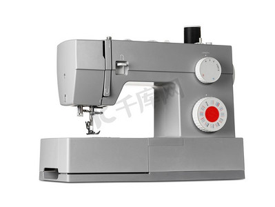 底板文理摄影照片_现代电动缝纫机，白色底板隔绝。现代电动缝纫机
