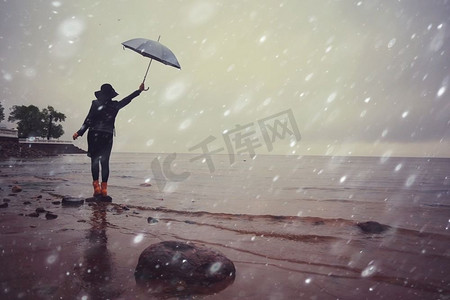 一个女人拿着一把伞在海上风雨中