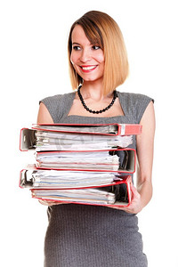 大量文件摄影照片_超负荷工作的女商人拿着大量文件孤立的白红文件夹