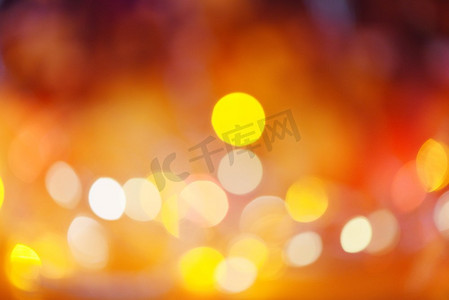 圣诞节灯橙色黄色和红色/灯bokeh抽象背景五彩圣诞节装饰新年概念