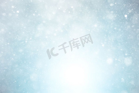 赛季摄影照片_雪花的降雪纹理在模糊的背景设计天气