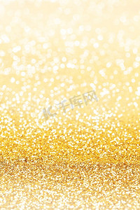 金色猪蹄子摄影照片_抽象的闪闪发光的金色假日波克背景