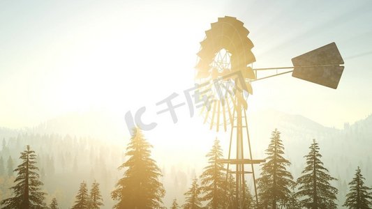 典型的老风车涡轮机在森林在日落