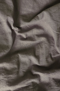 灰色织物、亚麻纹理、波浪形抽象背景