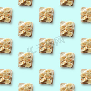 面包图案摄影照片_三明治以香蕉为蓝底，图案平铺。香蕉三明治，花纹