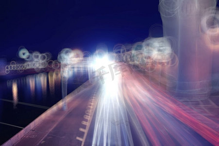 灯光闪烁摄影照片_模糊的背景城市灯光闪烁的水滴