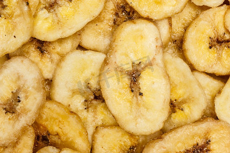 香蕉片，干燥的新鲜成熟香蕉片作为食物背景。.香蕉片背景