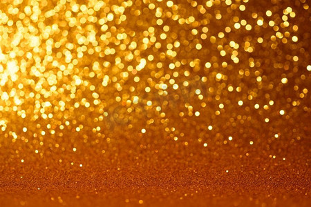 金色猪蹄子摄影照片_金色的圣诞节或新年节日背景。黄色圣诞节或新年背景