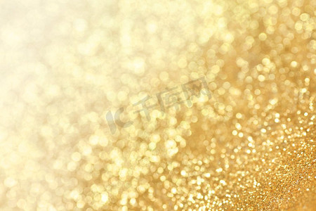 抽象的金色闪光波克节日派对背景。抽象的金色闪光背景