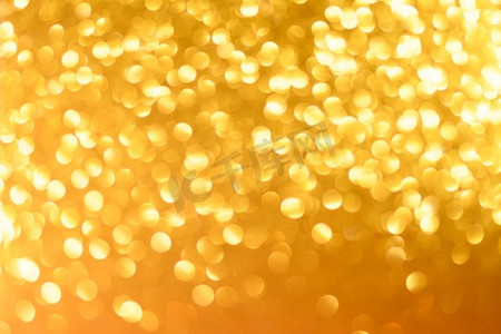 新年黄色摄影照片_金色的圣诞节或新年节日背景。黄色圣诞节或新年背景