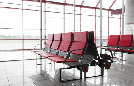 机场座椅摄影照片_旅行、旅游和离境概念—机场航站楼空座位。机场航站楼空座位