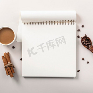 平板笔记本与咖啡杯肉桂棒