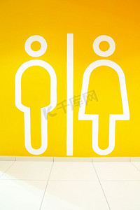 象征的男人和女人在橙色背景。标志厕所