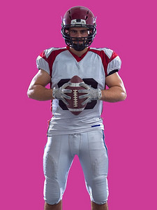 colorfull摄影照片_美国橄榄球运动员孤立在colorfull背景.一个强壮的肌肉美国橄榄球运动员的画象在五颜六色的背景隔绝