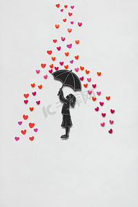创意情人节概念照，白色背景下，女孩撑着雨伞，有一颗雨心。