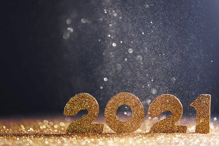 2021快乐摄影照片_新年快乐2021庆祝活动，蓝色背景的闪烁数字。2021新年快乐